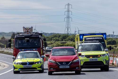 Nissan Leaf, police fire and ambulance services and Highways England's Traffic Officer service mark the opening of the flyover to traffic