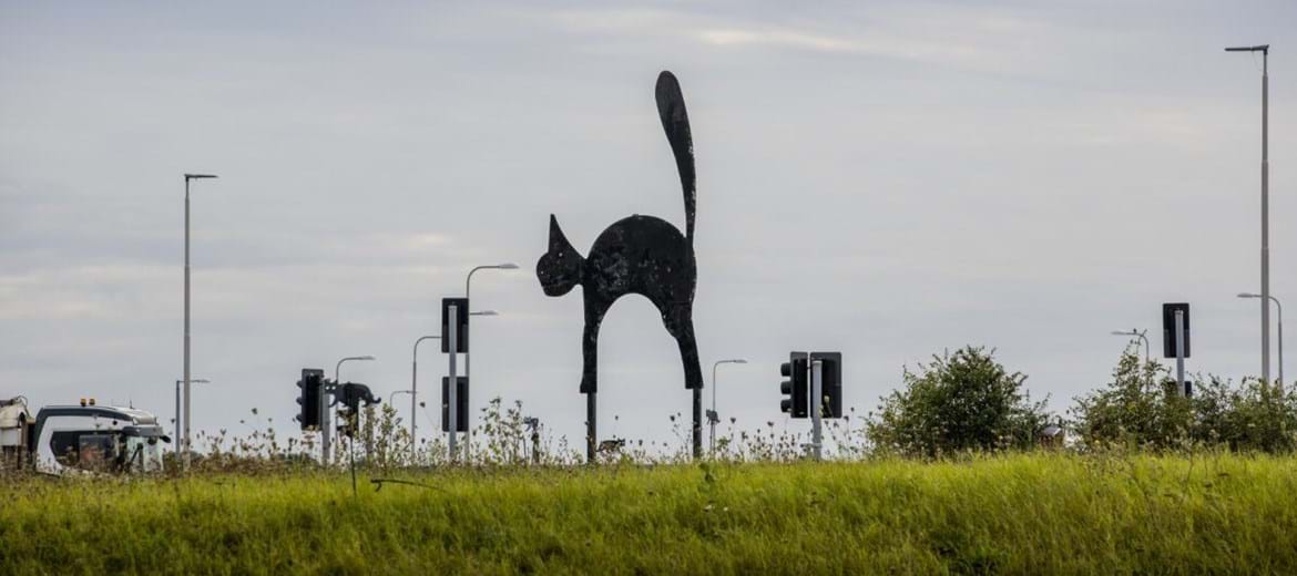 Black cat statue on the roundabout